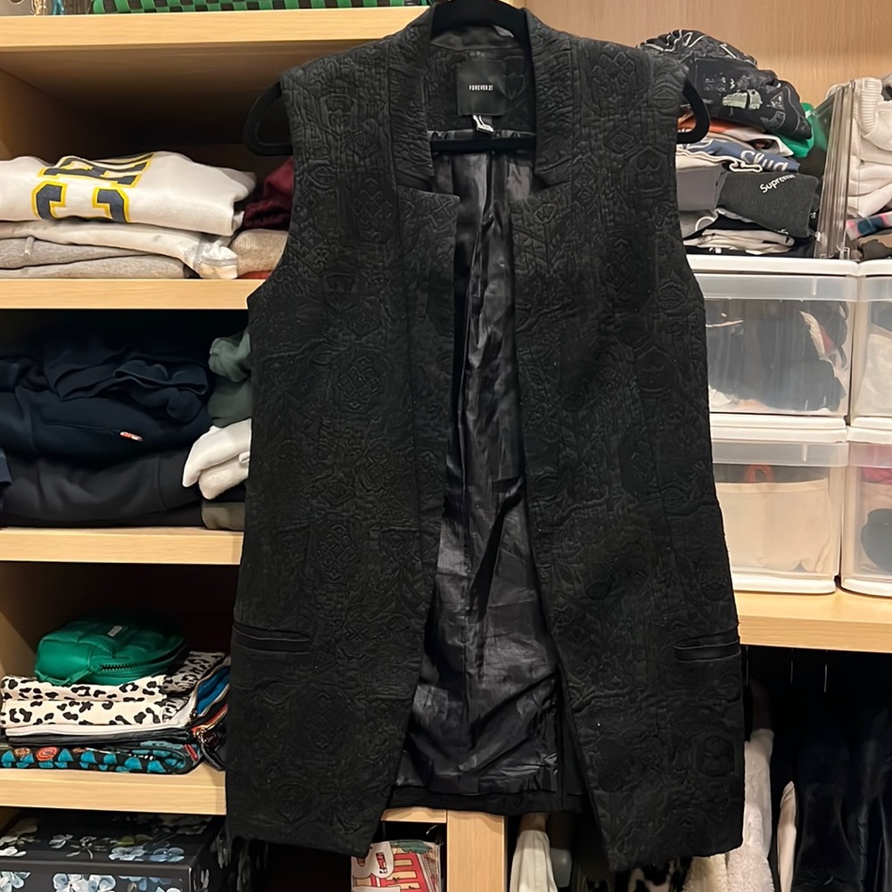 Sleeveless long vest